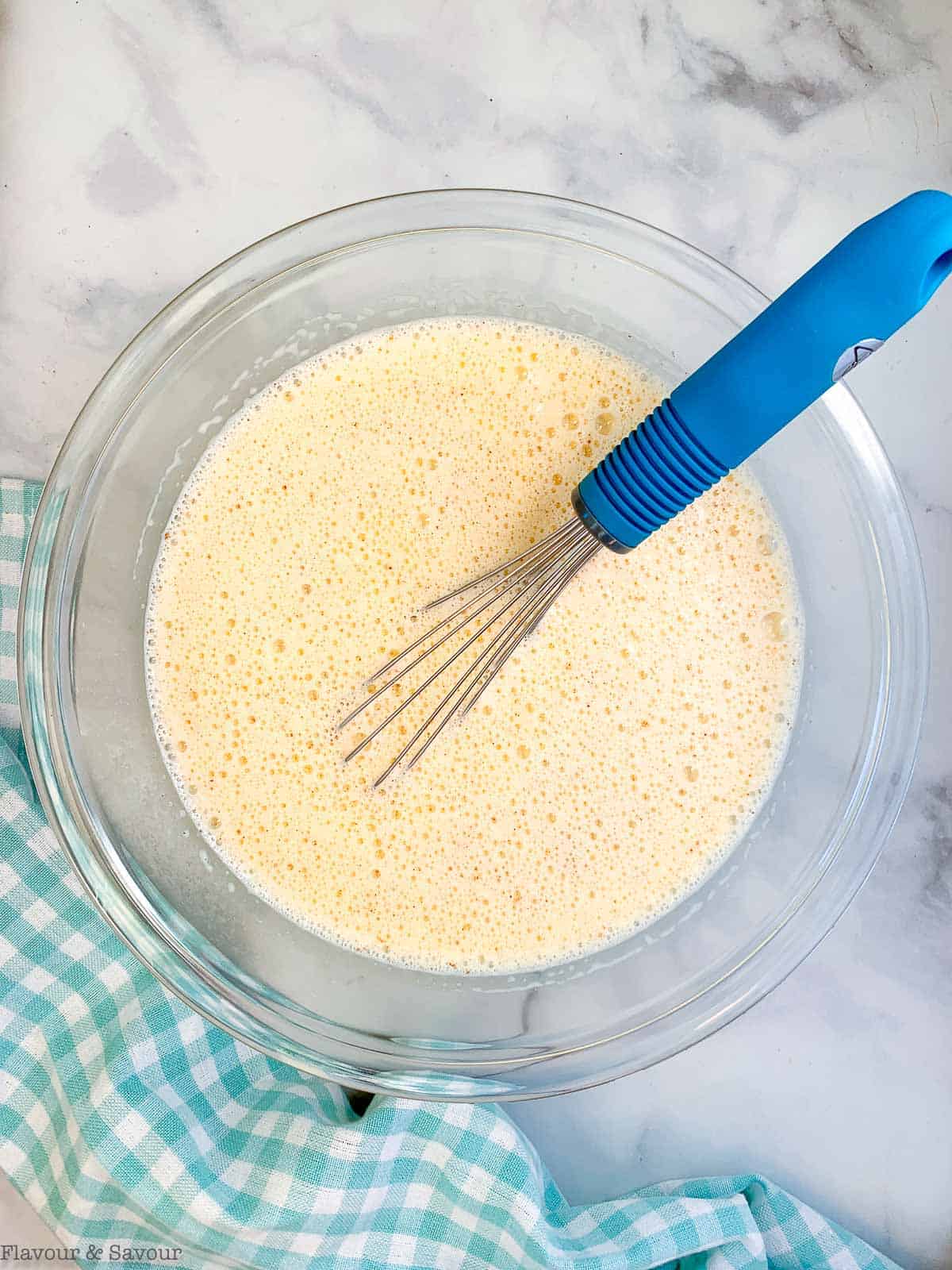 whisking custard for blueberry French toast