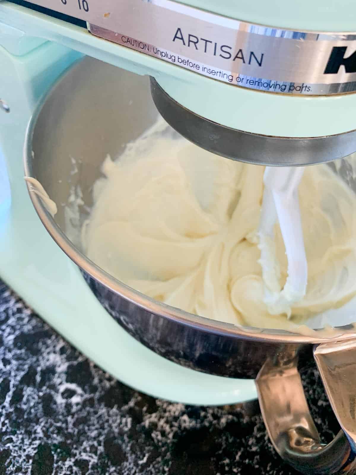 Cheesecake filling in electric mixer.