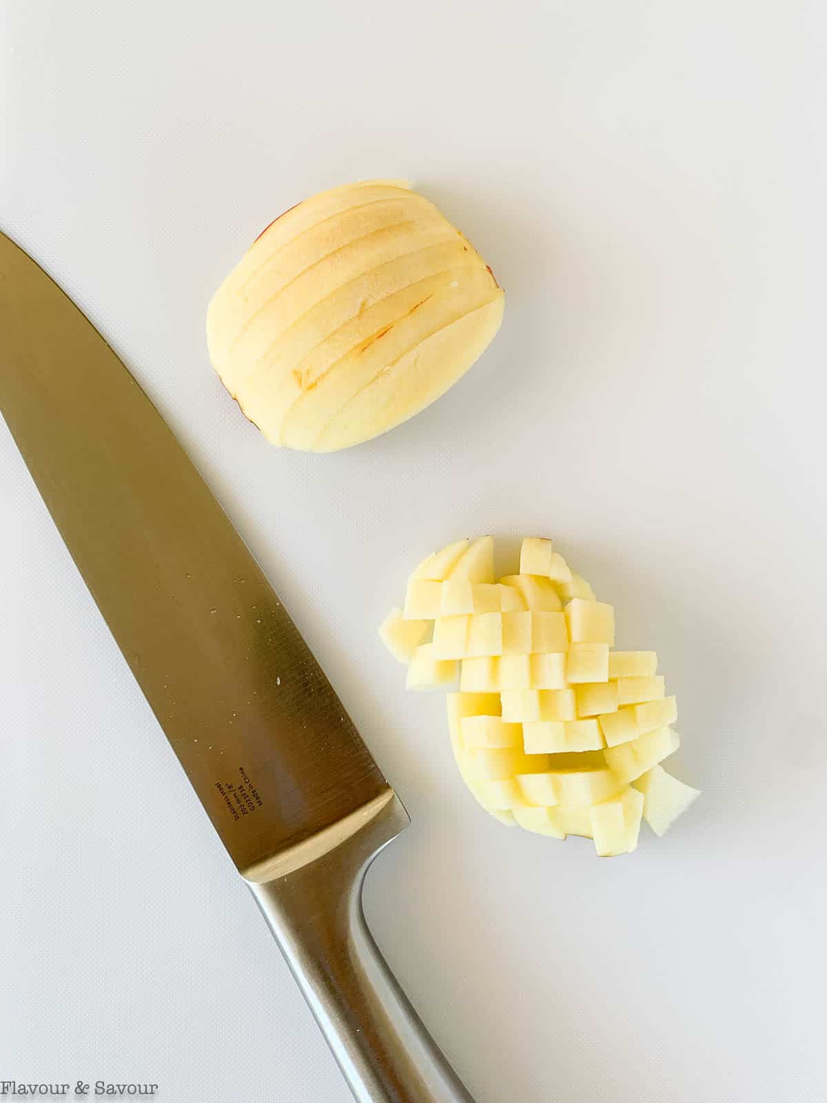 Finely diced apples for apple cheesecake crumble bars.