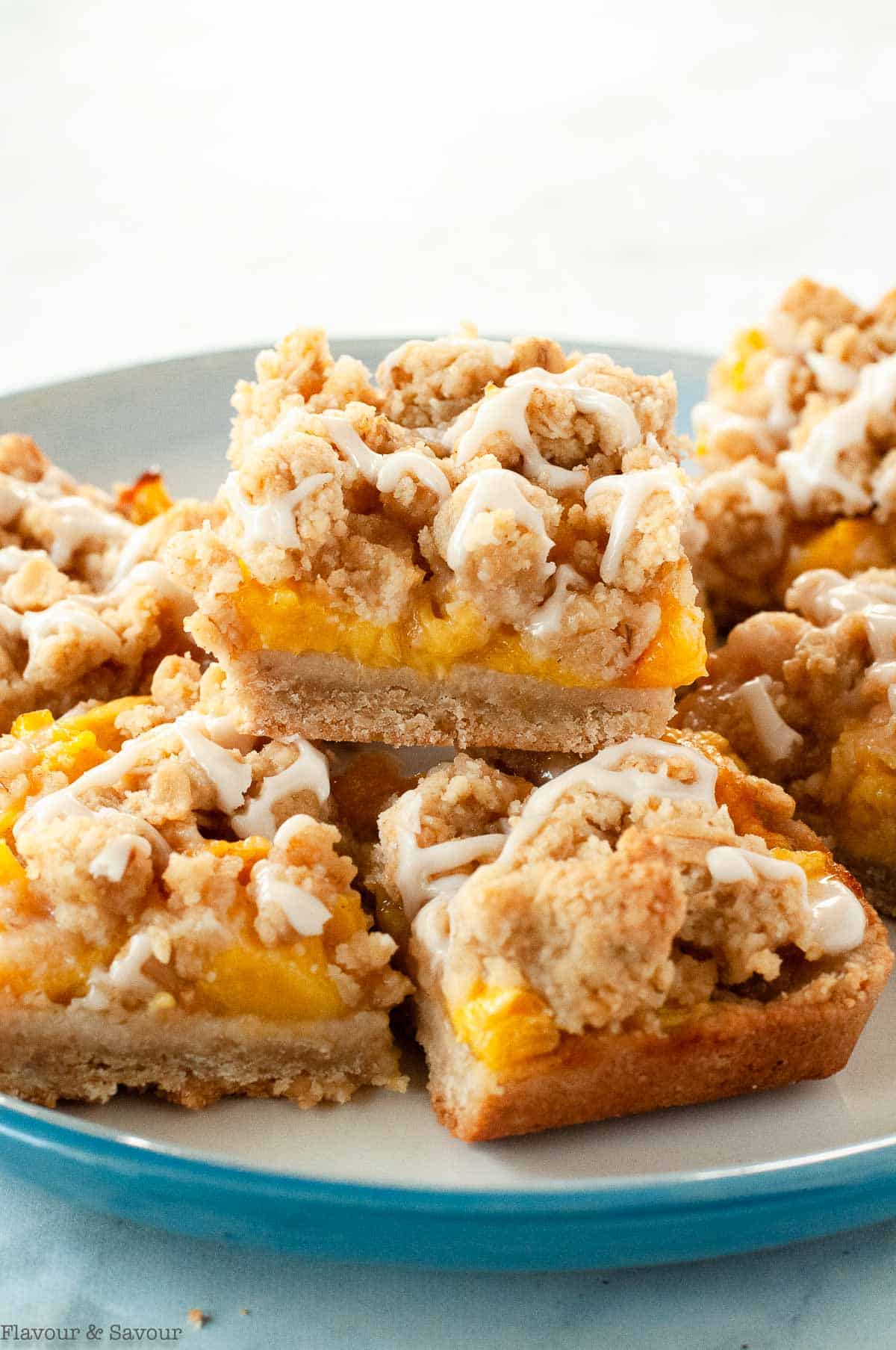 Gluten Free Peach Crumble Bars on a blue plate.