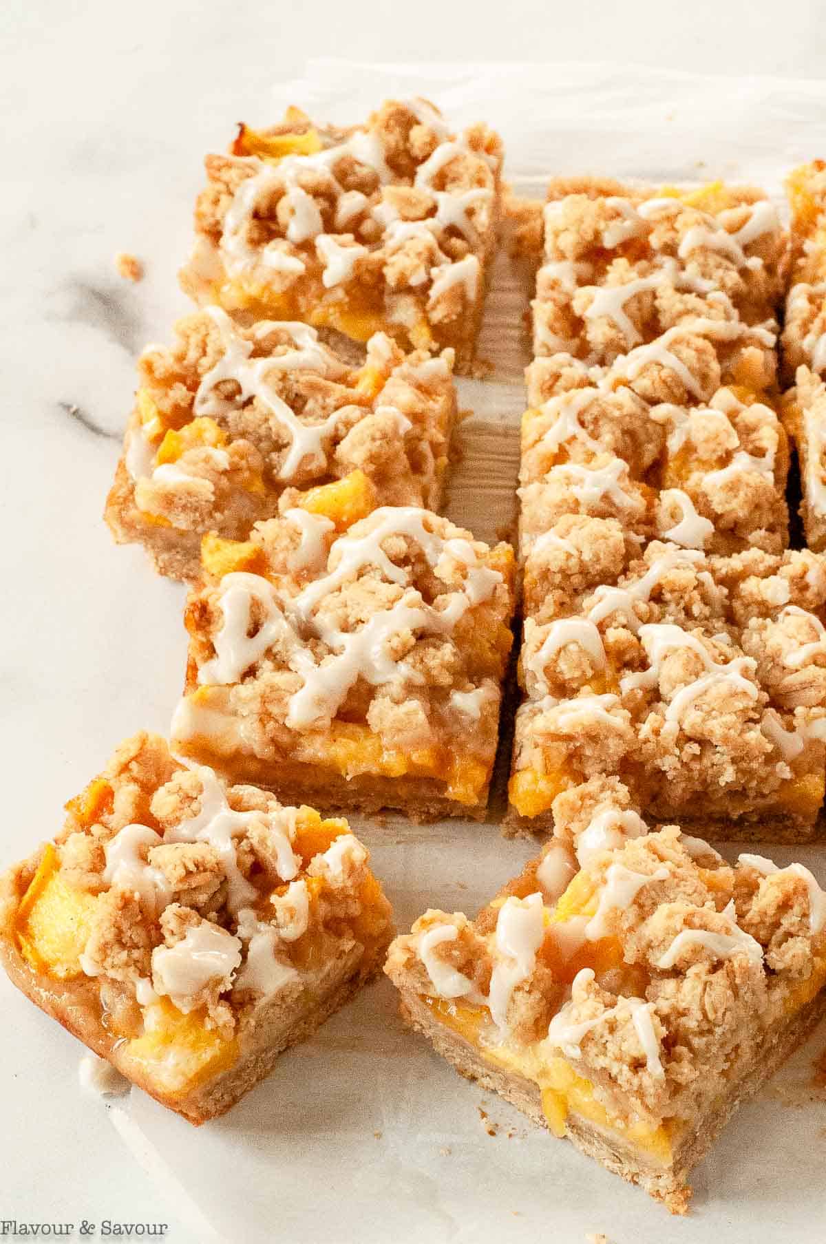 Sliced gluten free peach crumble bars