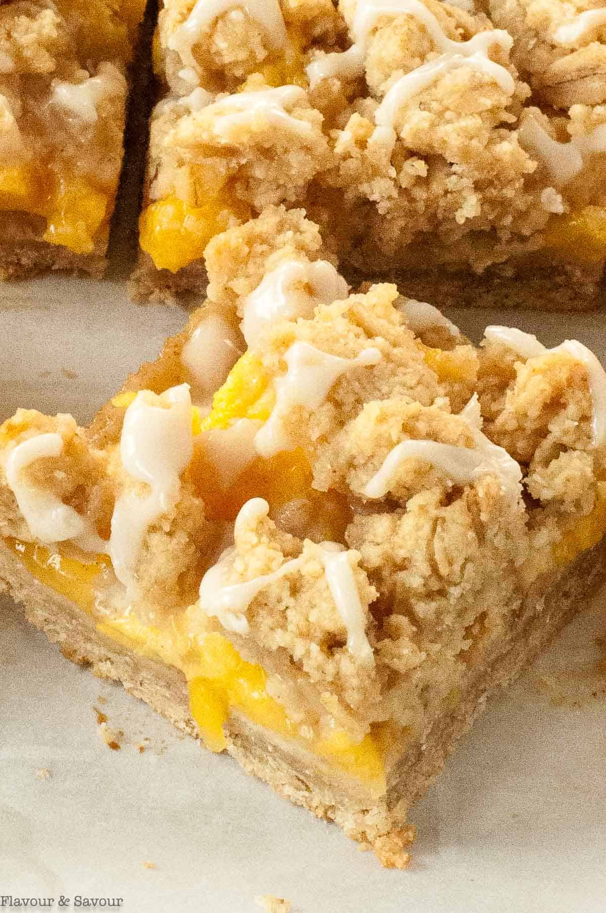 A single gluten free peach crumble bar.