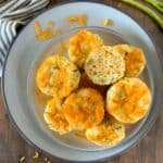 a plate full of zucchini cheddar muffins