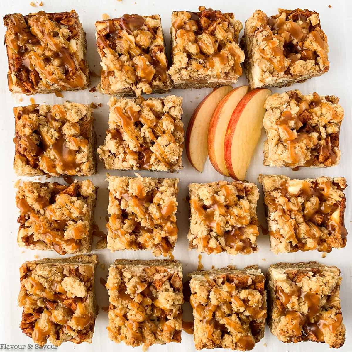 Sliced apple cheesecake crumble bars.