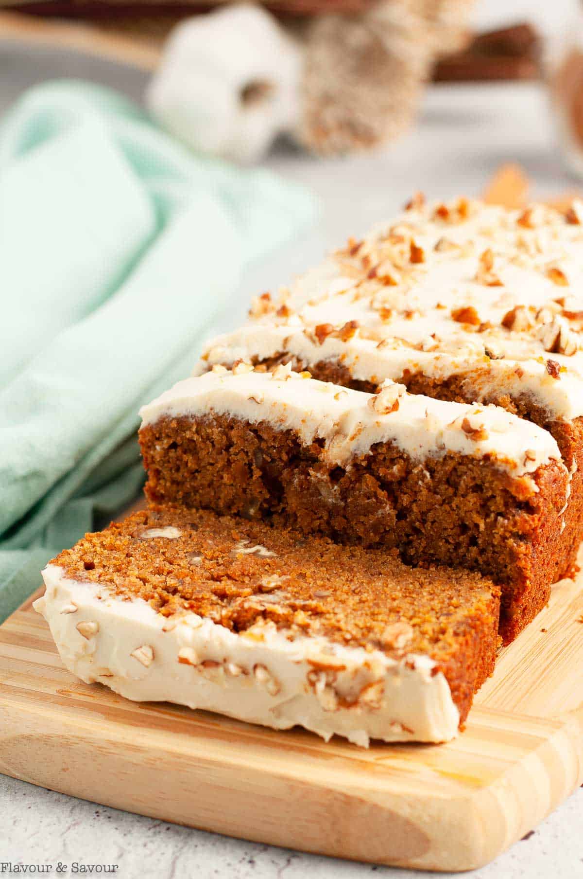 Gluten-free pumpkin spice loaf on a cutting board.