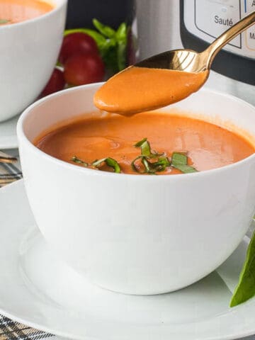 a bowl of instant pot tomato soup with cream