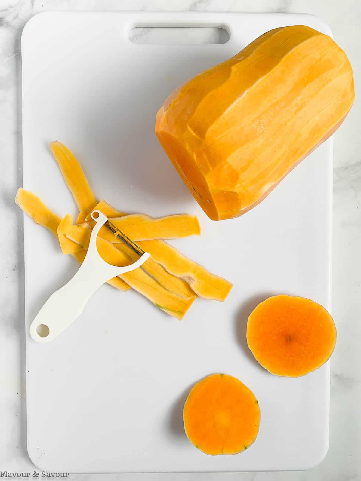 How to cut butternut squash, Step 1: Remove the ends with a sharp knife and peel the skin.