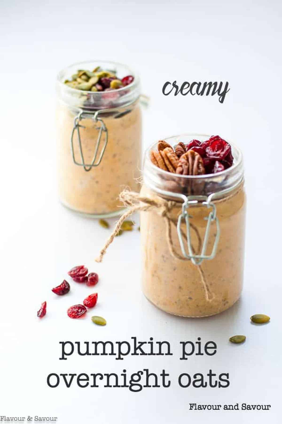 two jars of creamy pumpkin pie overnight oats with pecans and cranberries