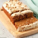 pumpkin spice bread sliced on a cutting board