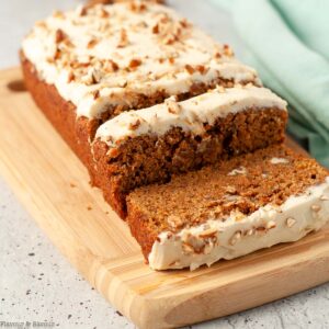 pumpkin spice bread sliced on a cutting board