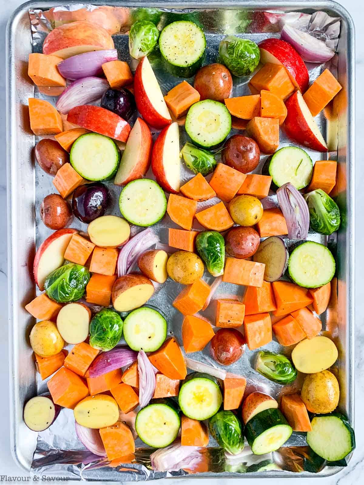 Raw vegetables on a sheet pan.