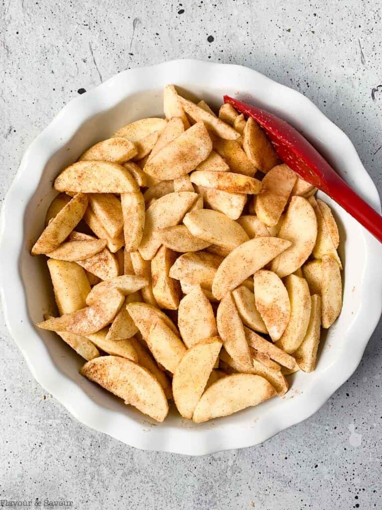 cinnamon apple slices in a baking dish for apple crisp