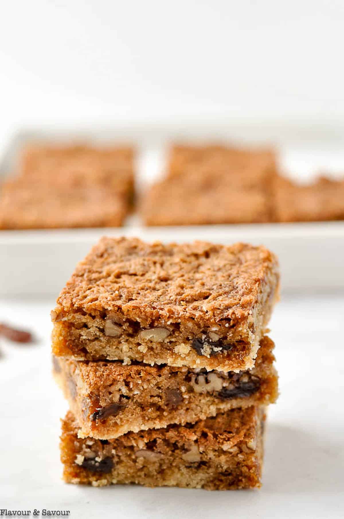 Butter tart squares stacked .