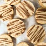 close up view of pumpkin spice almond cookies drizzled with chocolate