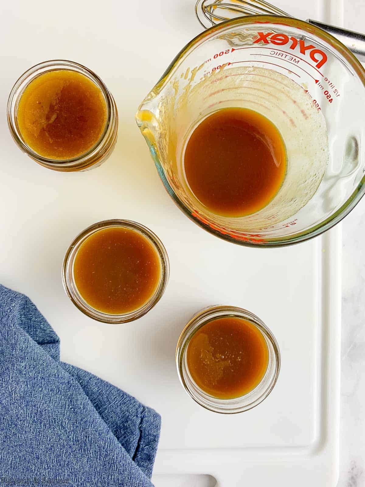 salted caramel bourbon sauce in small Mason jars