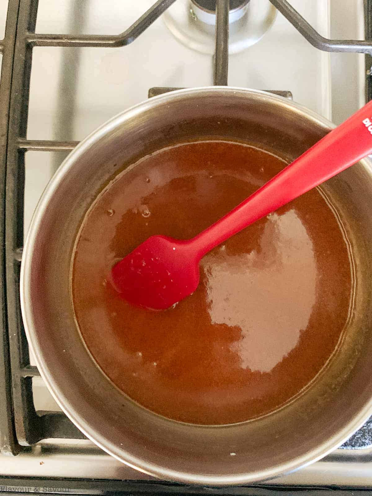 Step 6 to make salted caramel sauce, stir in salt until smooth.