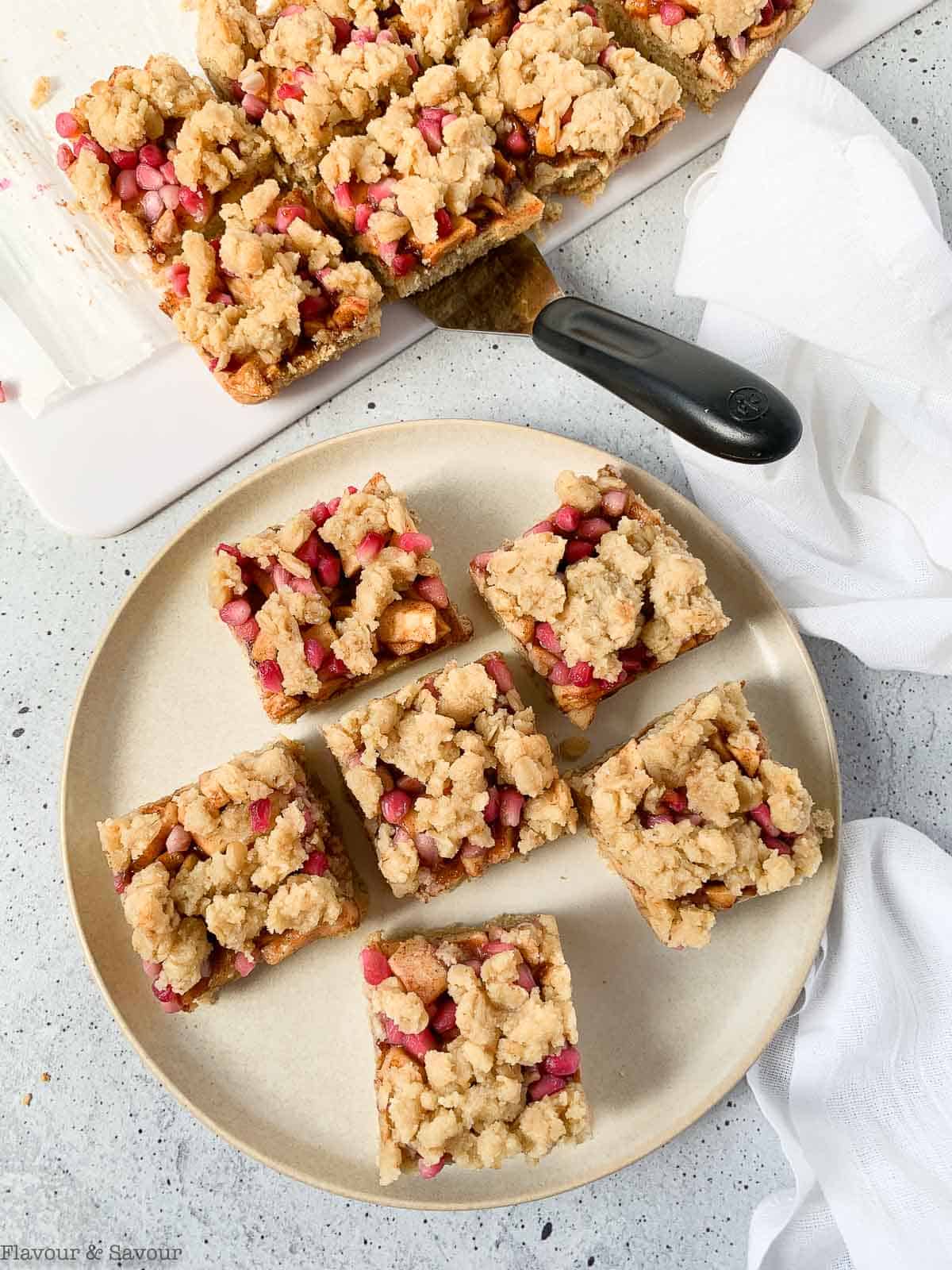 Apple Pomegranate Crumble Bars on a plate