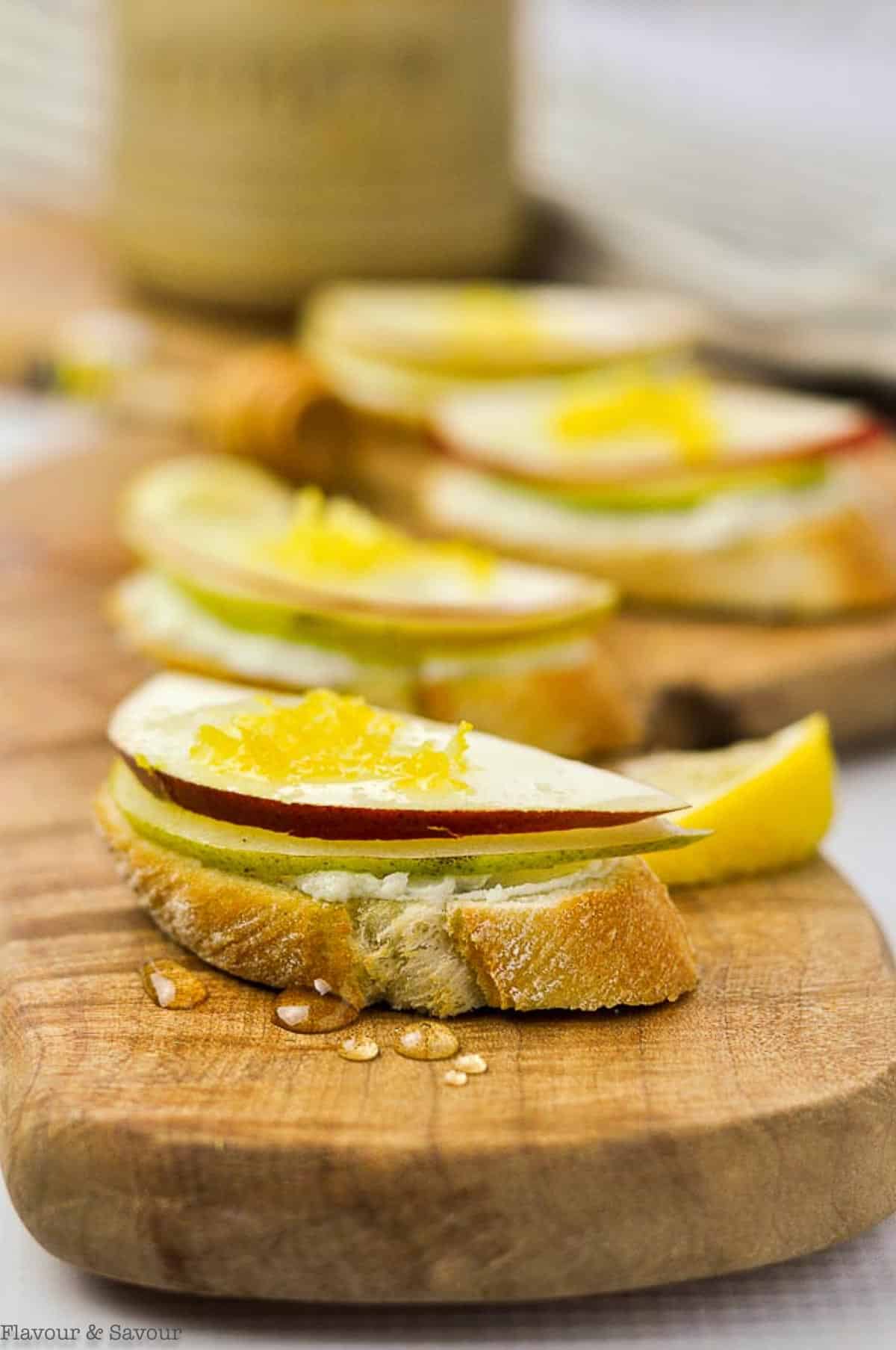 blue cheese and honeyed pear crostini on a serving board