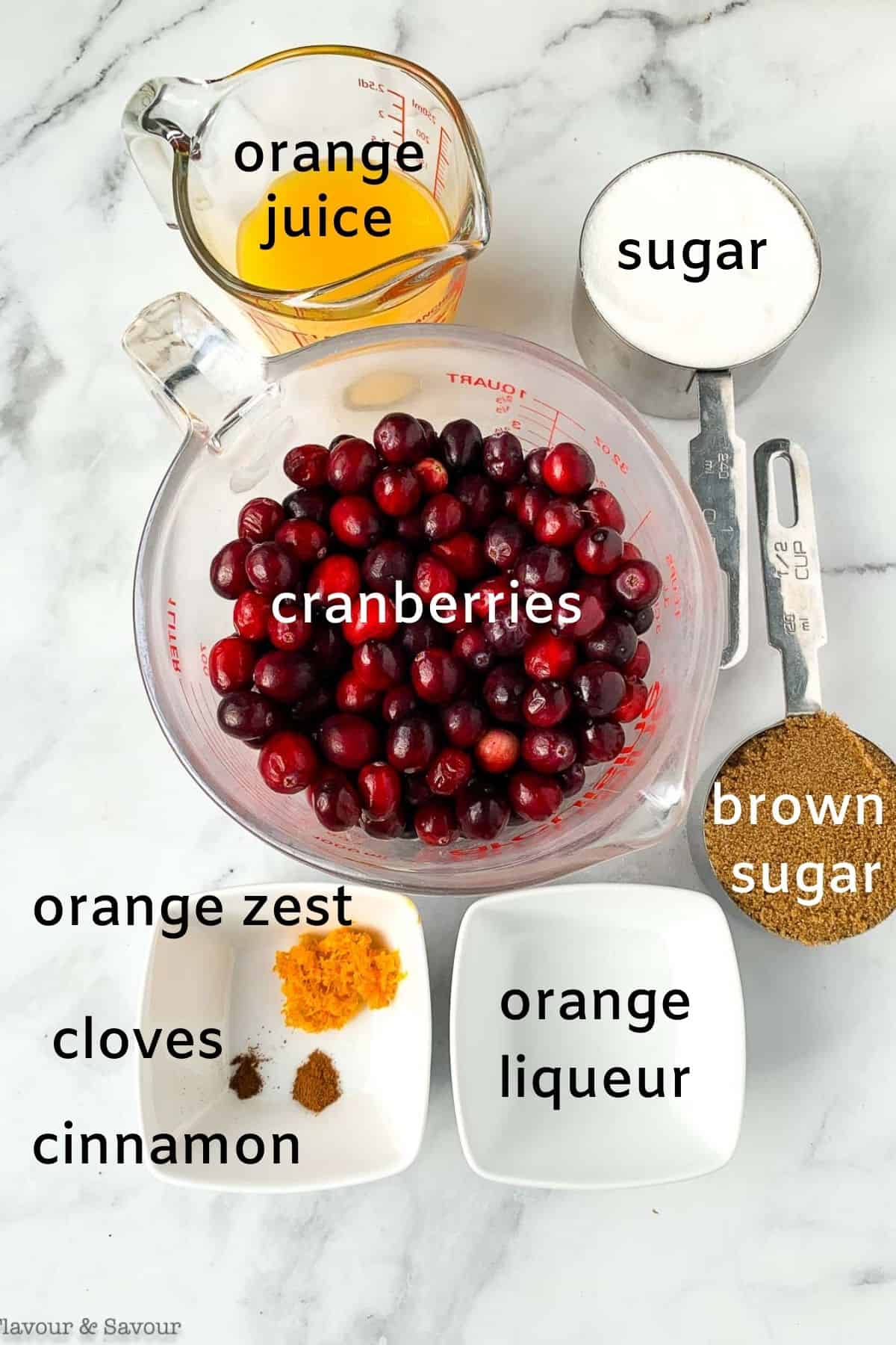 Ingredients for spiced cranberry orange sauce with Triple Sec.
