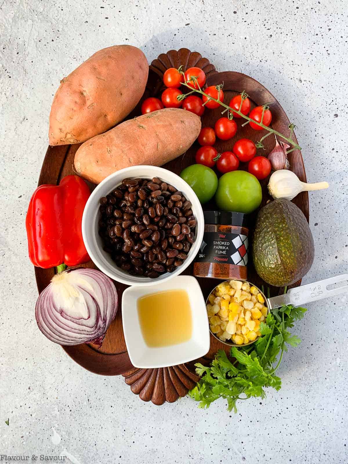 Ingredients for black bean stuffed sweet potatoes on a tray