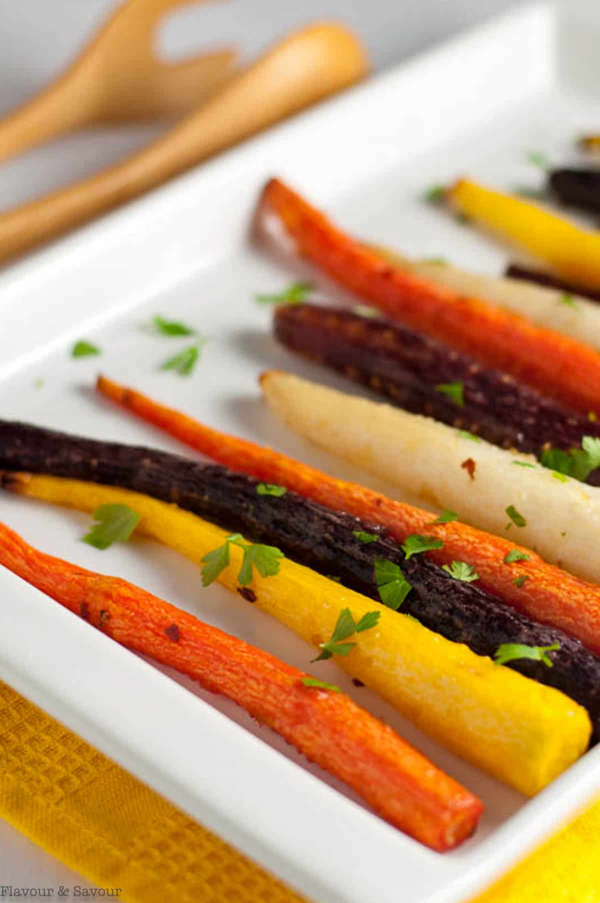 Roasted honey-ginger glazed carrots sprinkled with parsley.