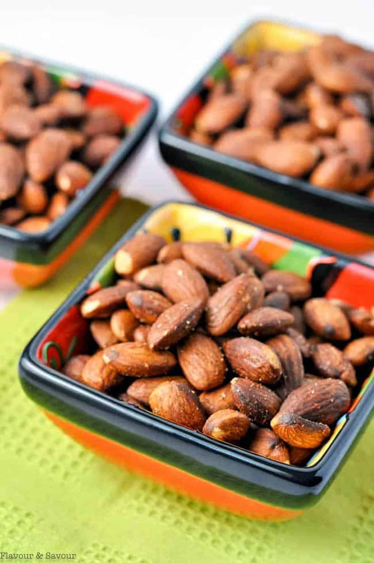 Small square bowls of Spanish spiced almonds.