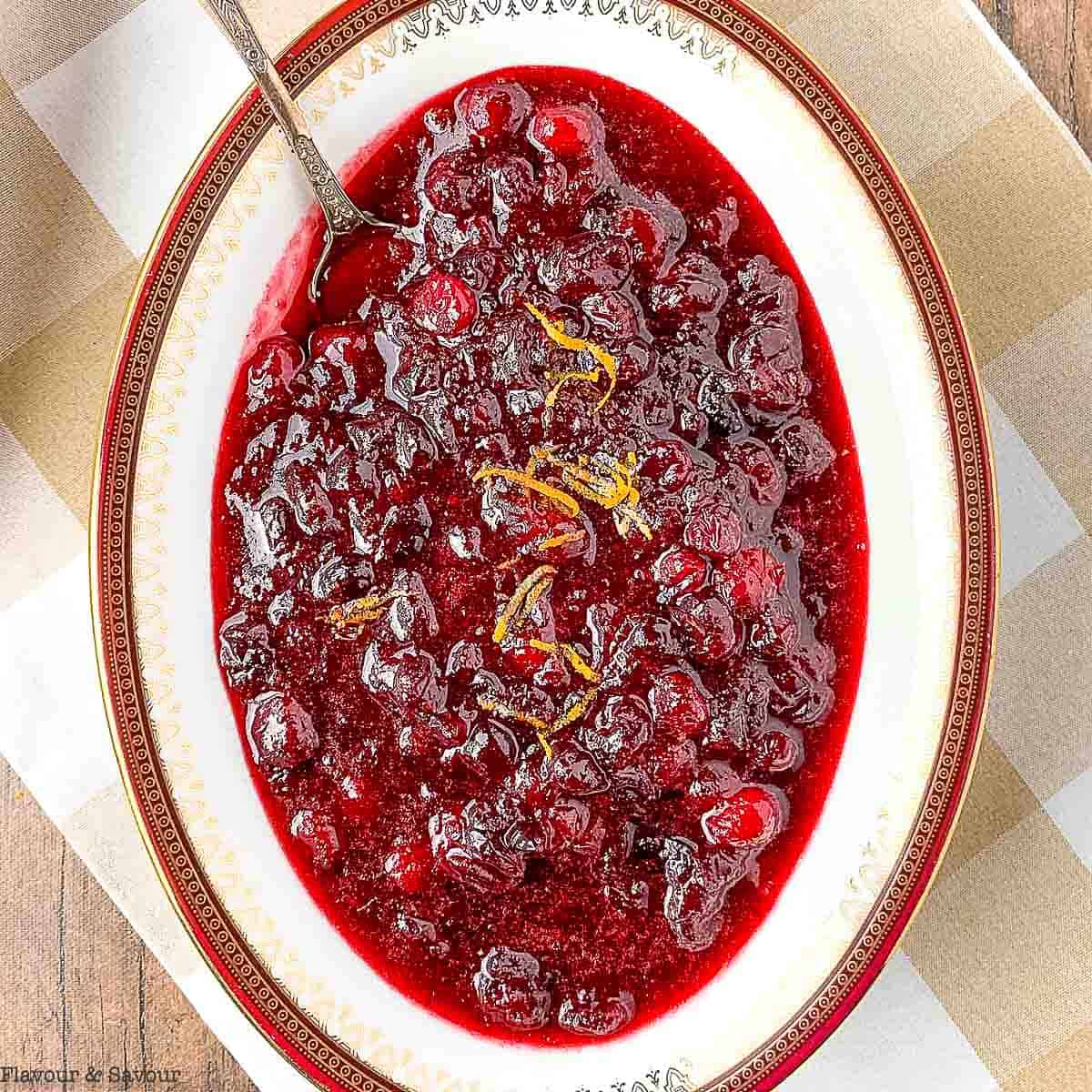  An oval bowl of spiced cranberry orange sauce.