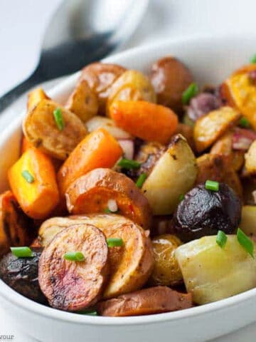 a bowl of apple cider roasted root vegetables