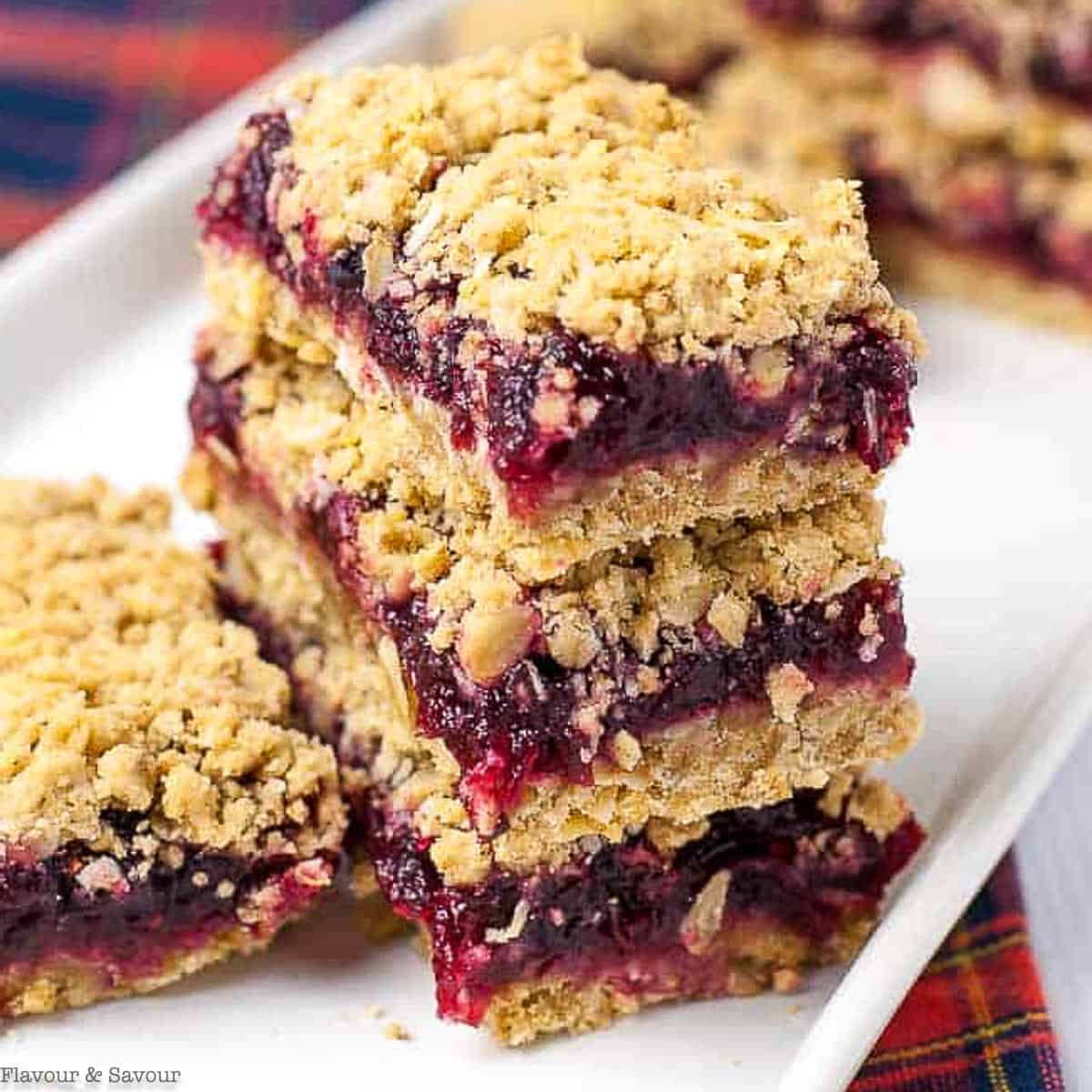 close up view of cranberry oatmeal crumble bars 