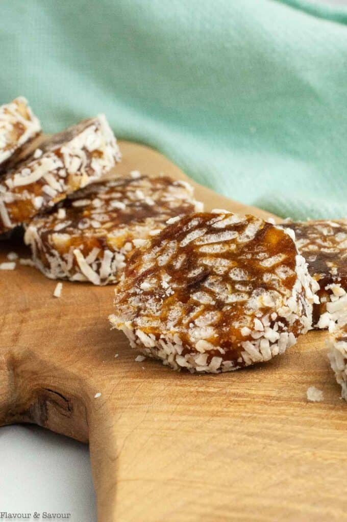 close up view of no bake coconut date log slices