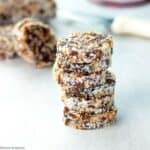 No bake coconut date logs sliced and stacked.