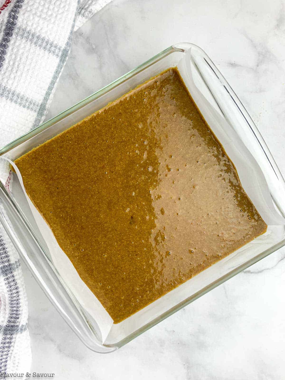 Gingerbread cake in baking pan ready to bake.