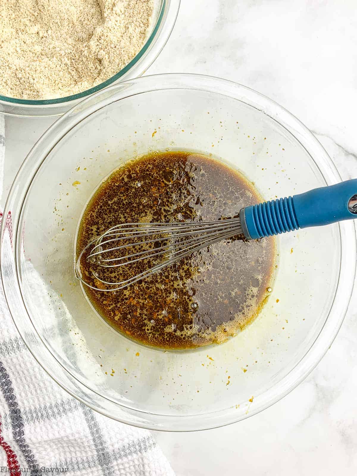 Gingerbread cake wet ingredients in a bowl.