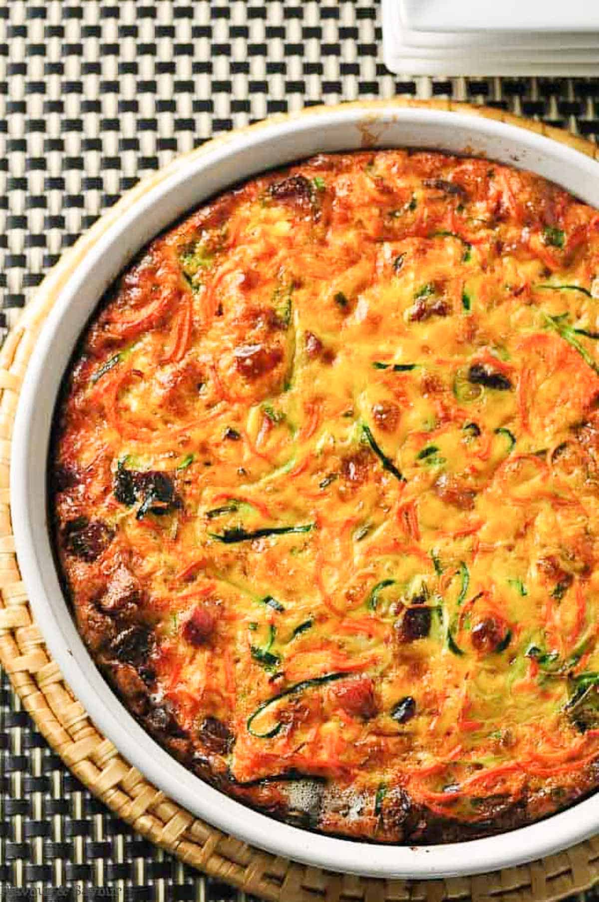crustless zucchini quiche with carrots in a quiche dish