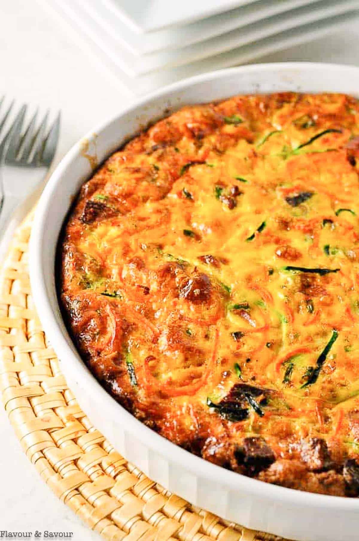 quiche with zucchini, carrots, herbs and bacon