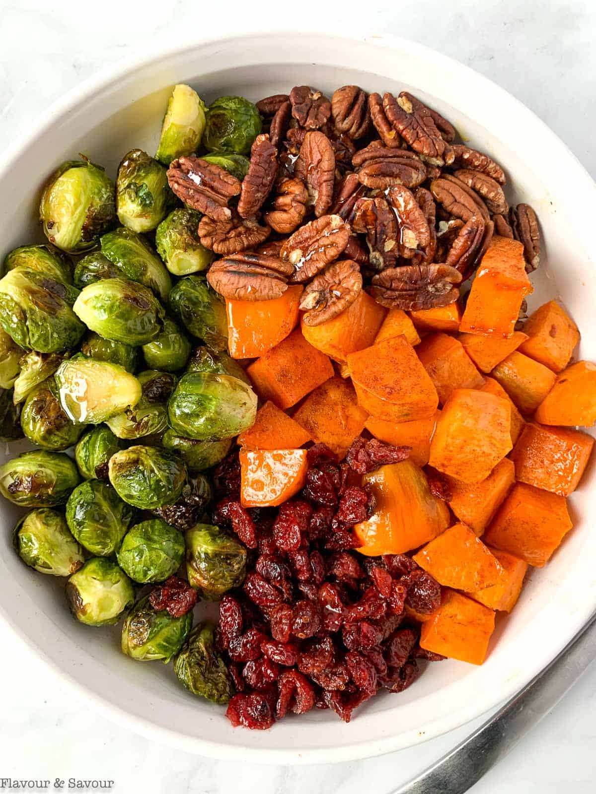 Ingredients for roasted Brussels sprouts side dish before tossing together.