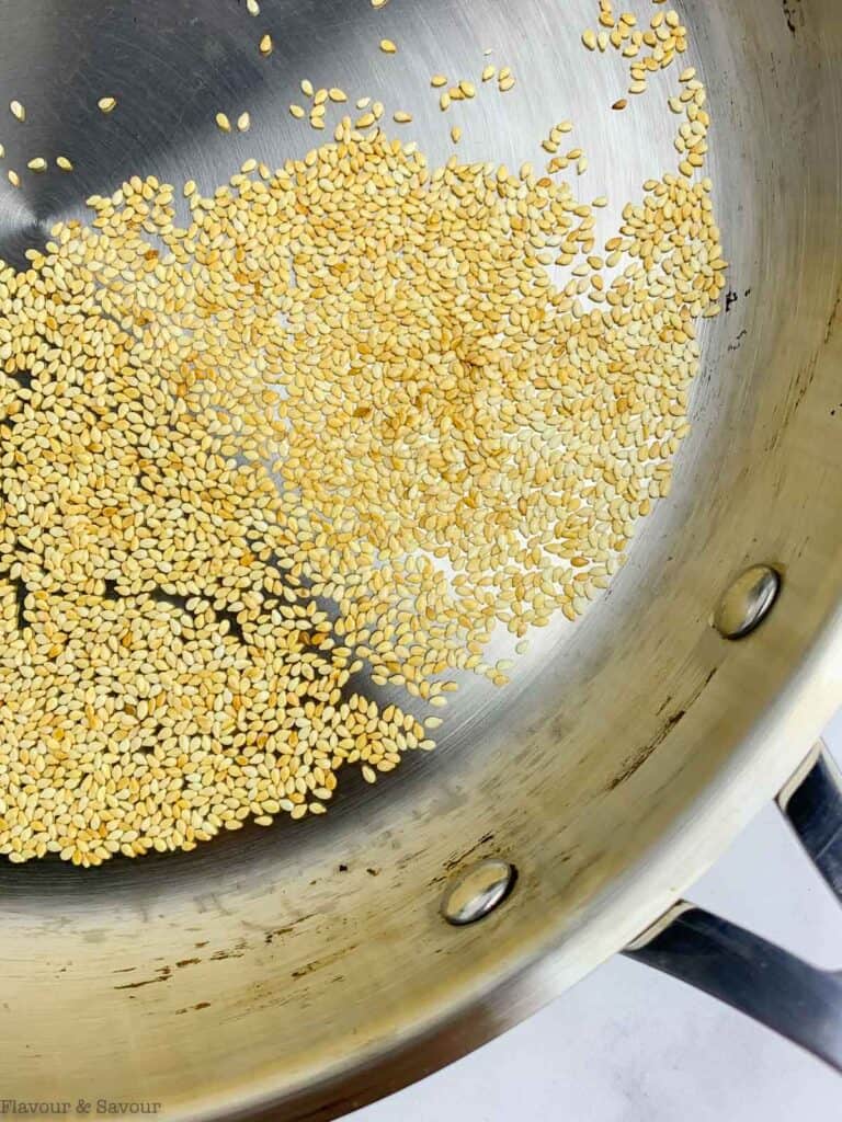 Sesame seeds in a skillet.