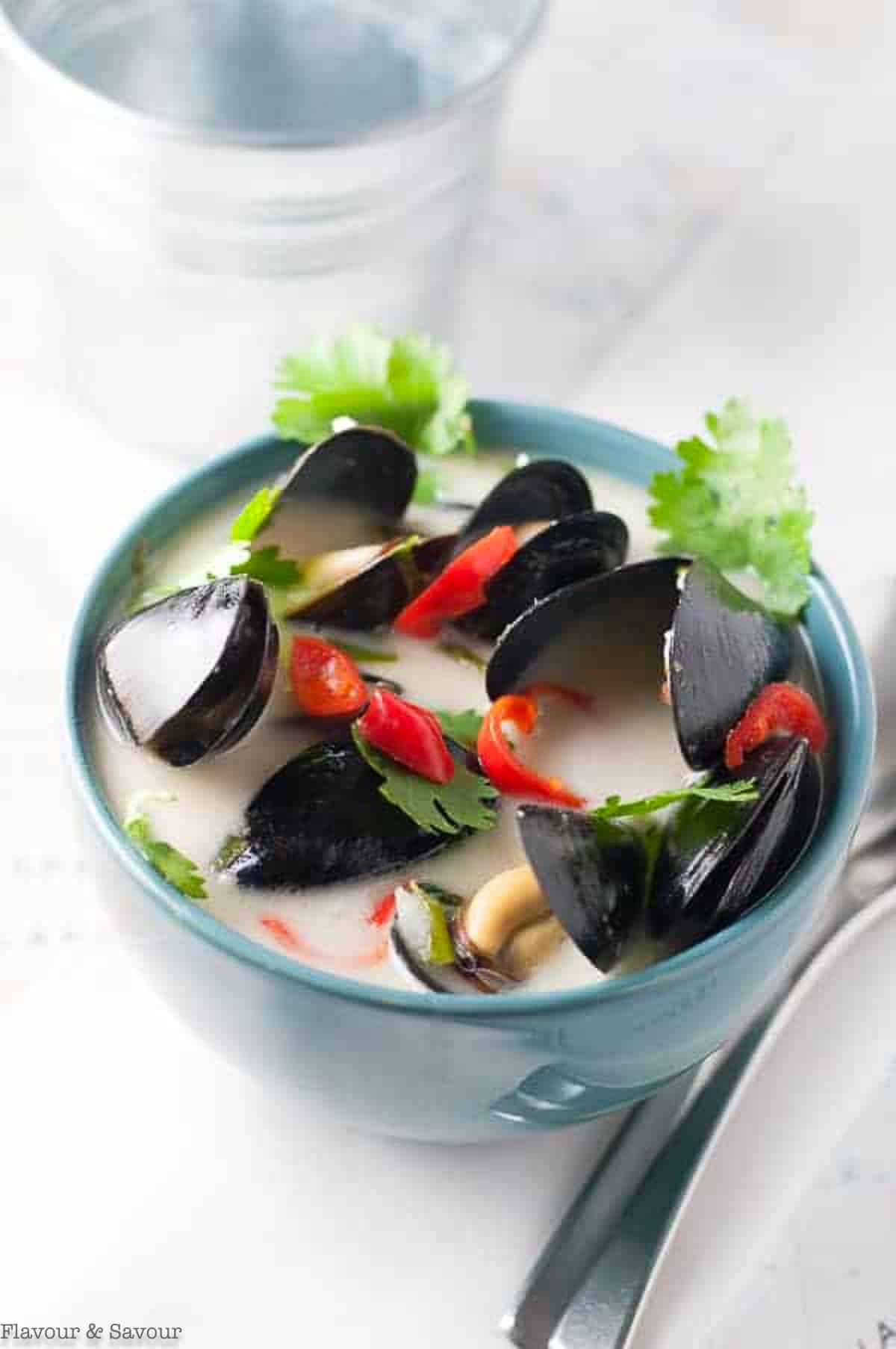 a bowl of spicy Thai mussels cooked in coconut milk