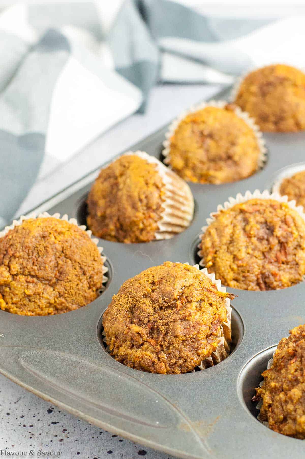 carrot ginger muffins in muffin tin