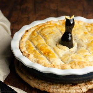 a baked vegetarian pot pie with a pie bird