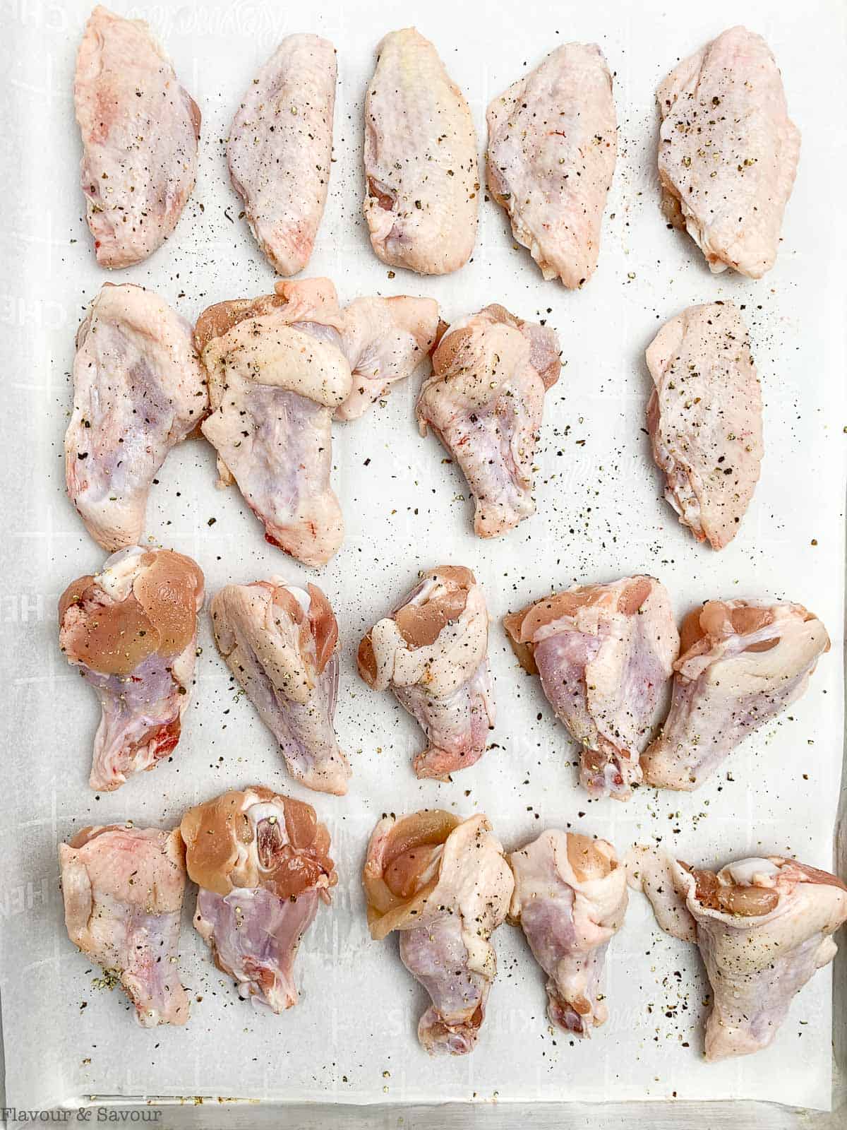 chicken wings sprinkled with salt and pepper.