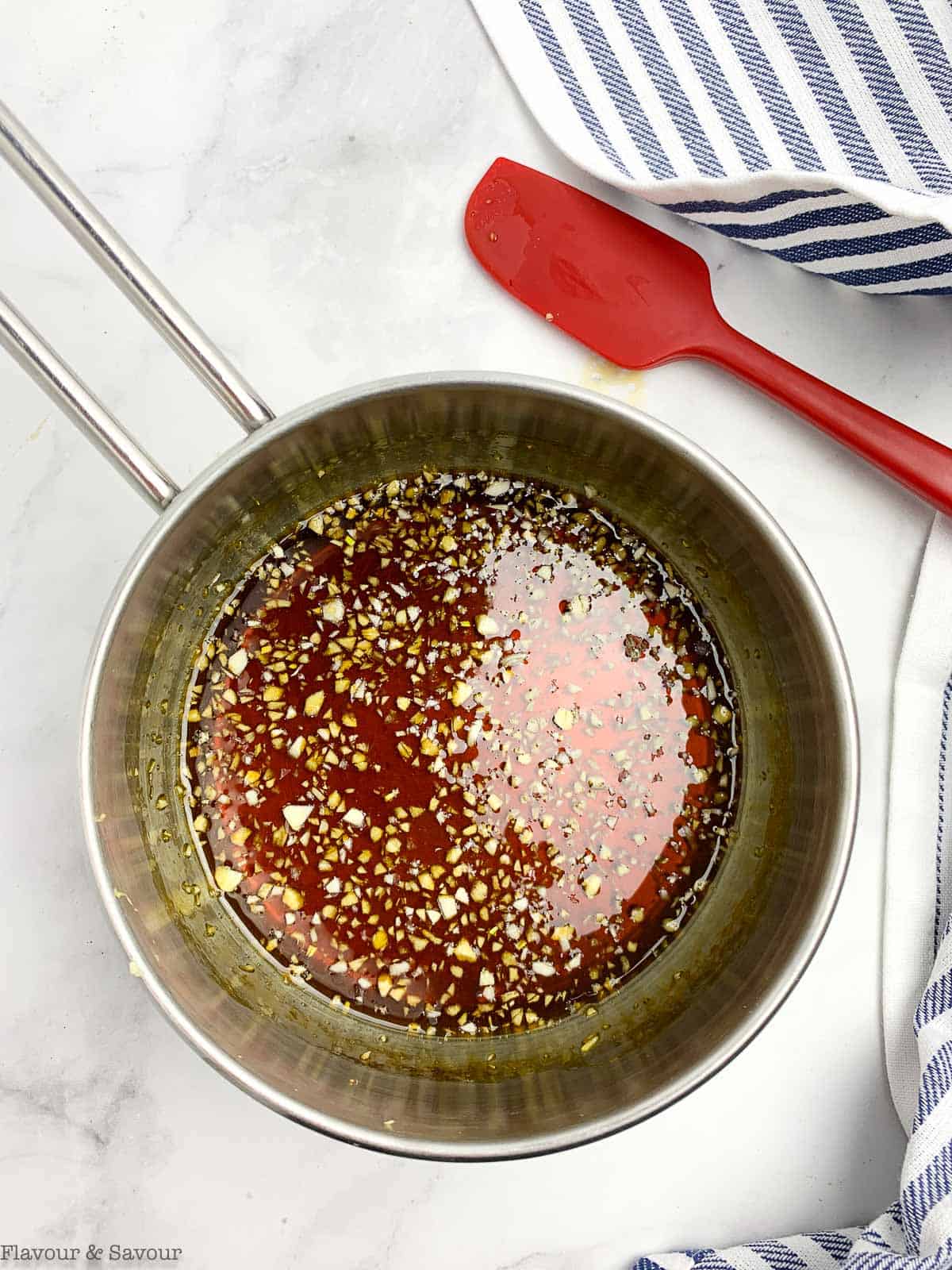 Honey garlic sauce ingredients in a saucepan.