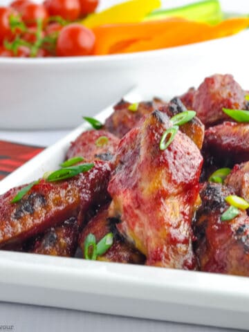 a platter of cranberry glazed chili chicken wings