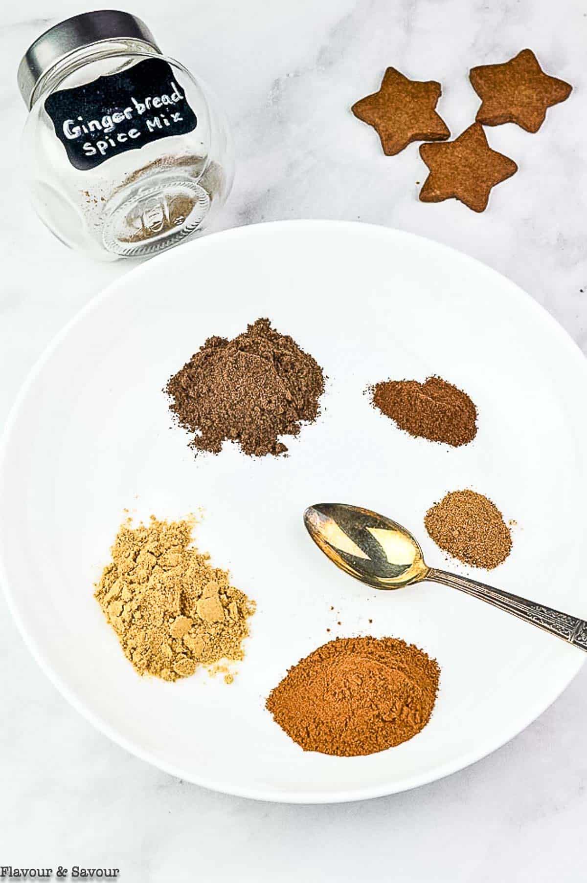 mounds of measured spices to make gingerbread spice mix