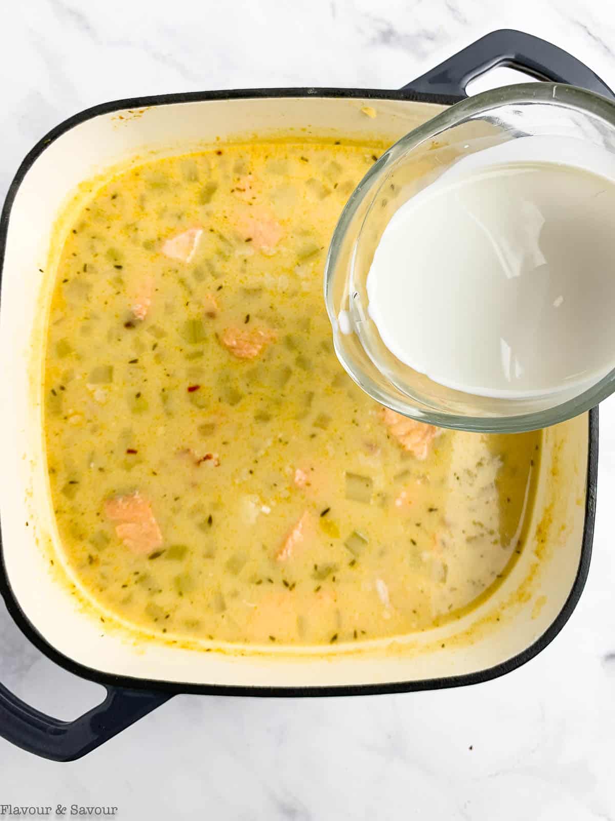 add cream or plant-based milk to seafood pot pie filling