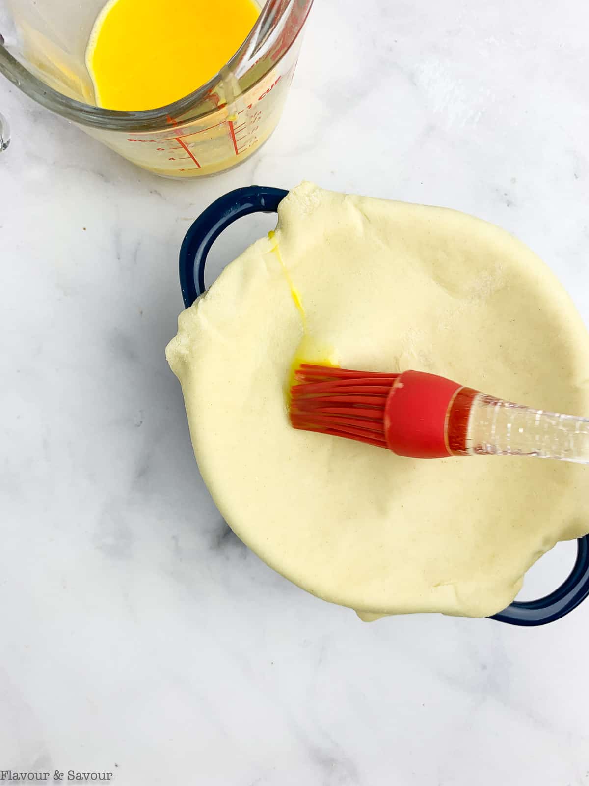 Brush puff pastry with beaten egg