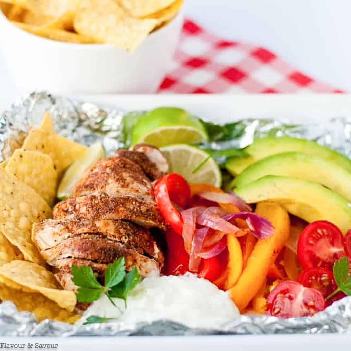close up view of chicken fajitas in foil packets