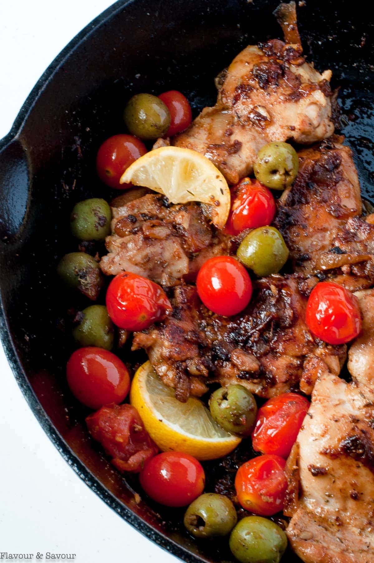 Moroccan chicken thighs with tomatoes and olives.