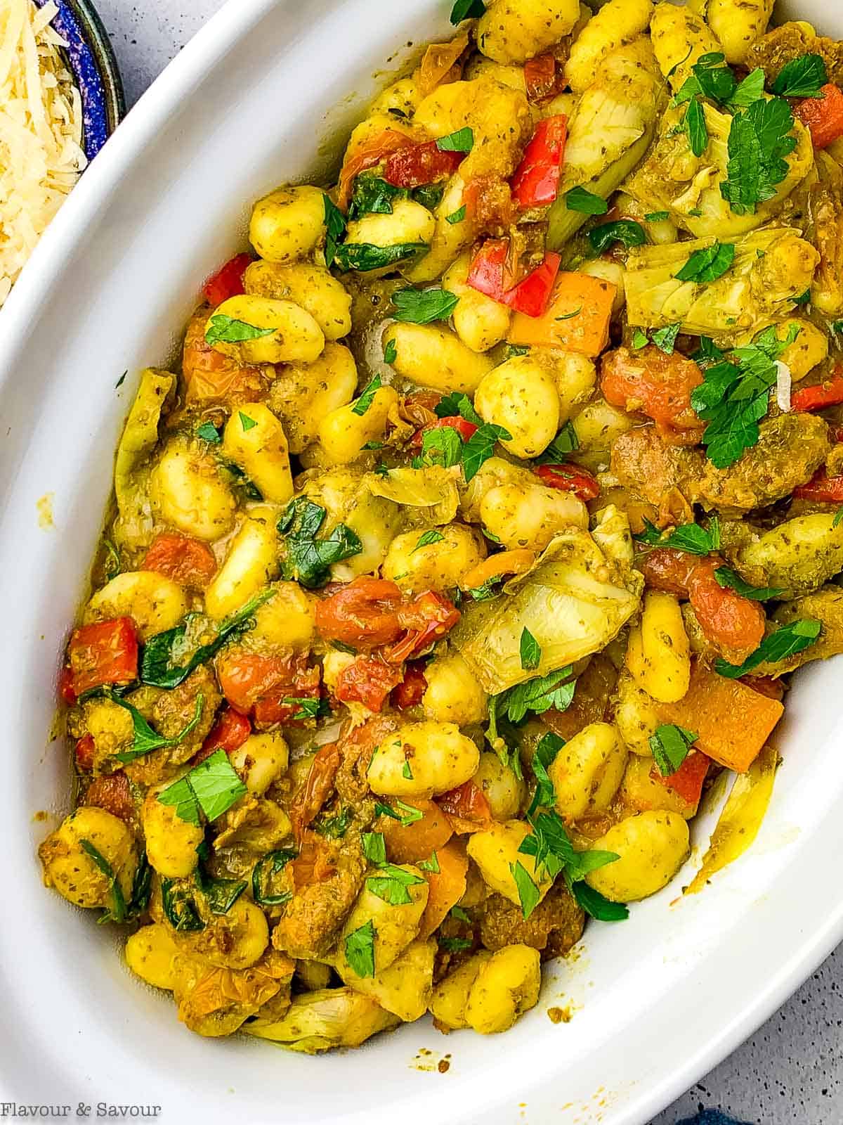 Vegetarian pesto gnocchi in a serving dish.