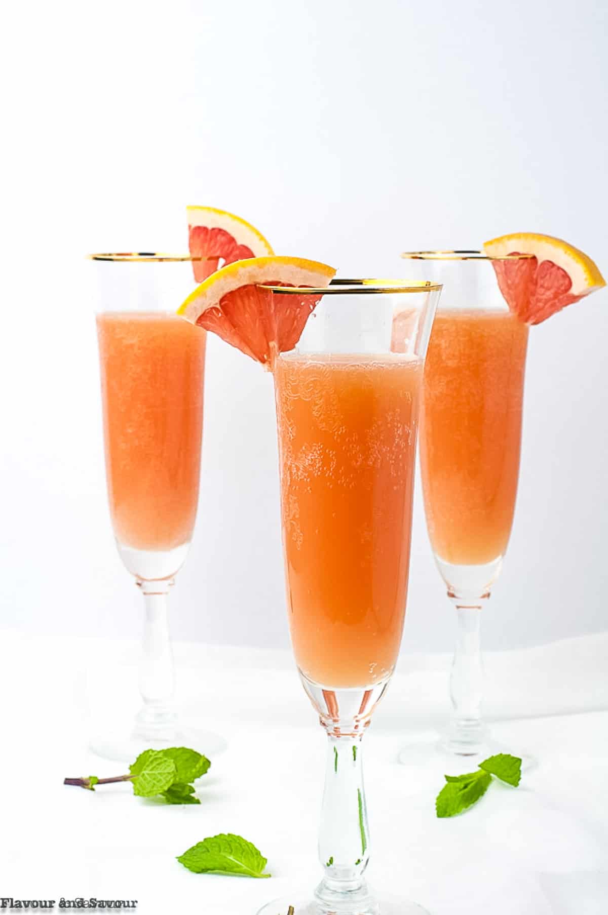 3 Champagne flutes with sugar-free grapefruit ginger mocktail